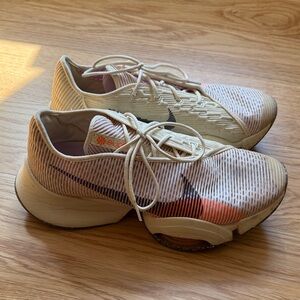 Nike Cream and Orange Running Shoes